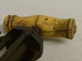   four pillar narrow rack Kings corkscrew with a shaped bone handle