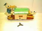 donald duck and pluto wind up hand car good cond