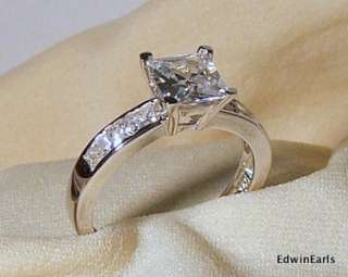  center stone is approximately 1.50 ct and has 3 Princess Cut stones 