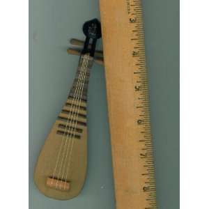 Wooden Miniature Stringed Instrument. 4 Strings. Gold Symbol on Top 