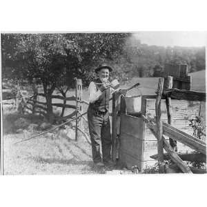  Old man drinking from dipper at well,c1912,wooden fence 