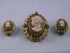 VINTAGE GOLD TONE PLASTIC CARVED CAMEO BROOCH & CLIP EARRINGS SET