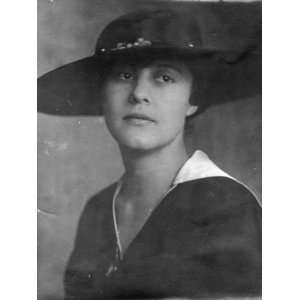  Photograph of an Elegant Woman Wearing a Hat Premium 