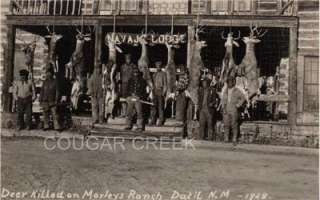 Nine Native American Hunters with Rifles and Nine Huge Mule Deer Bucks 